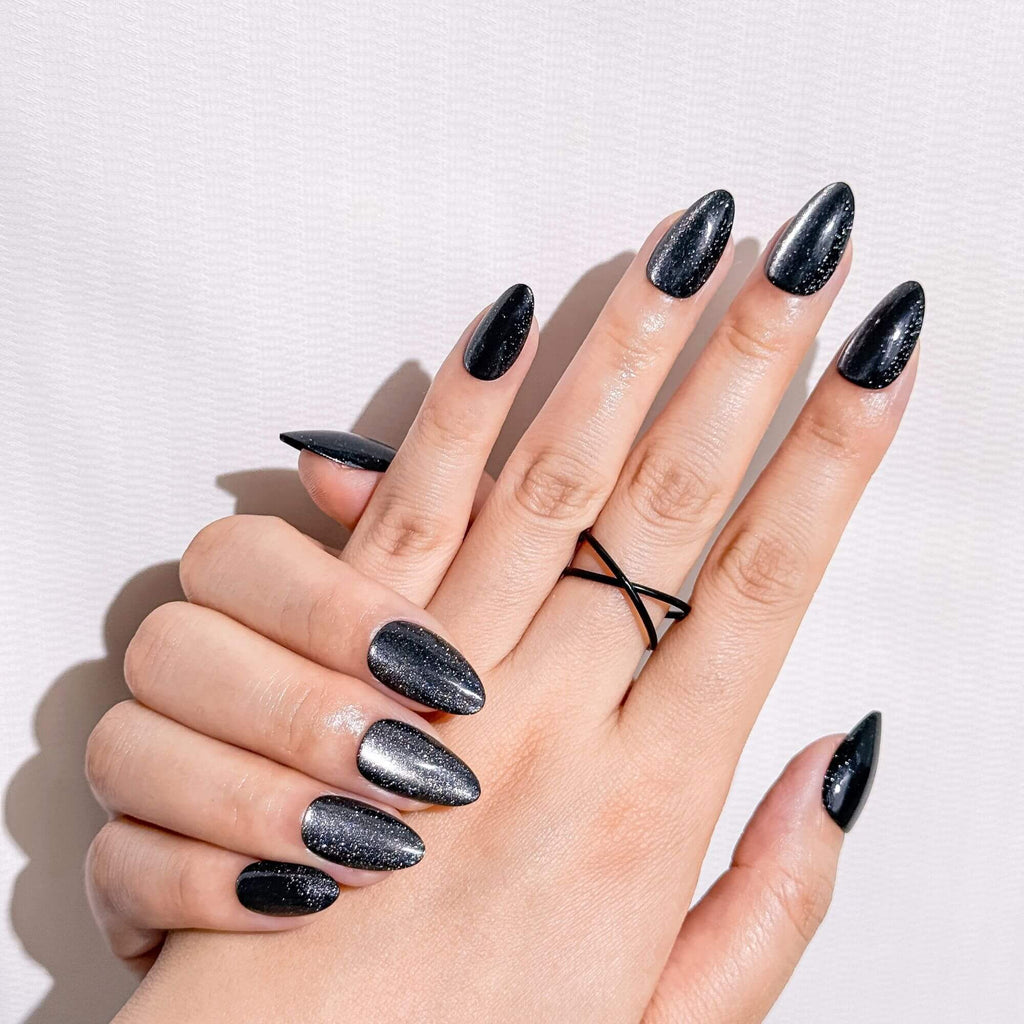 Aesthetic shot of Galaxy Noir black shimmer press-on nails, perfect for a bold and elegant artificial nail design.