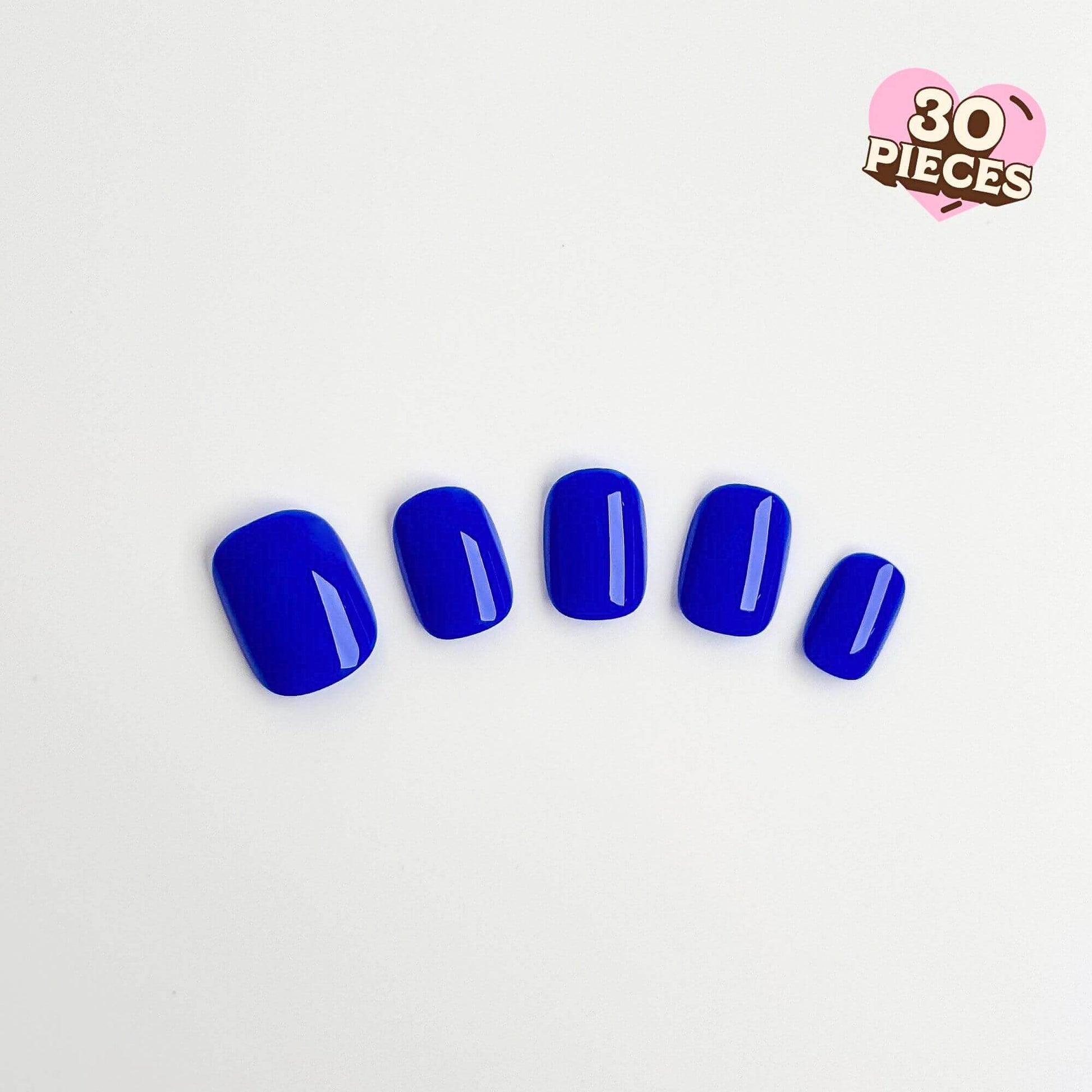 Vibrant cobalt blue press-on nails in a short square shape