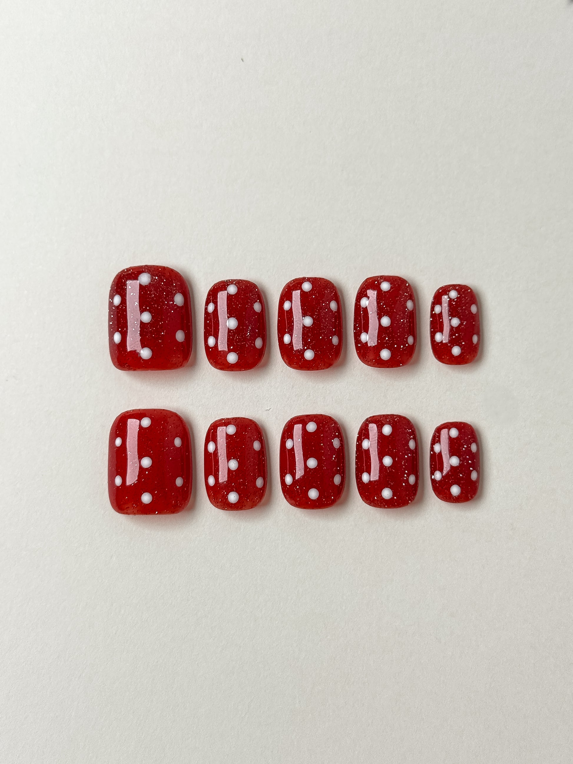 10 pieces of justmee press on nails, red color, square shape with white dots on top. perfect for a festival season like christmas